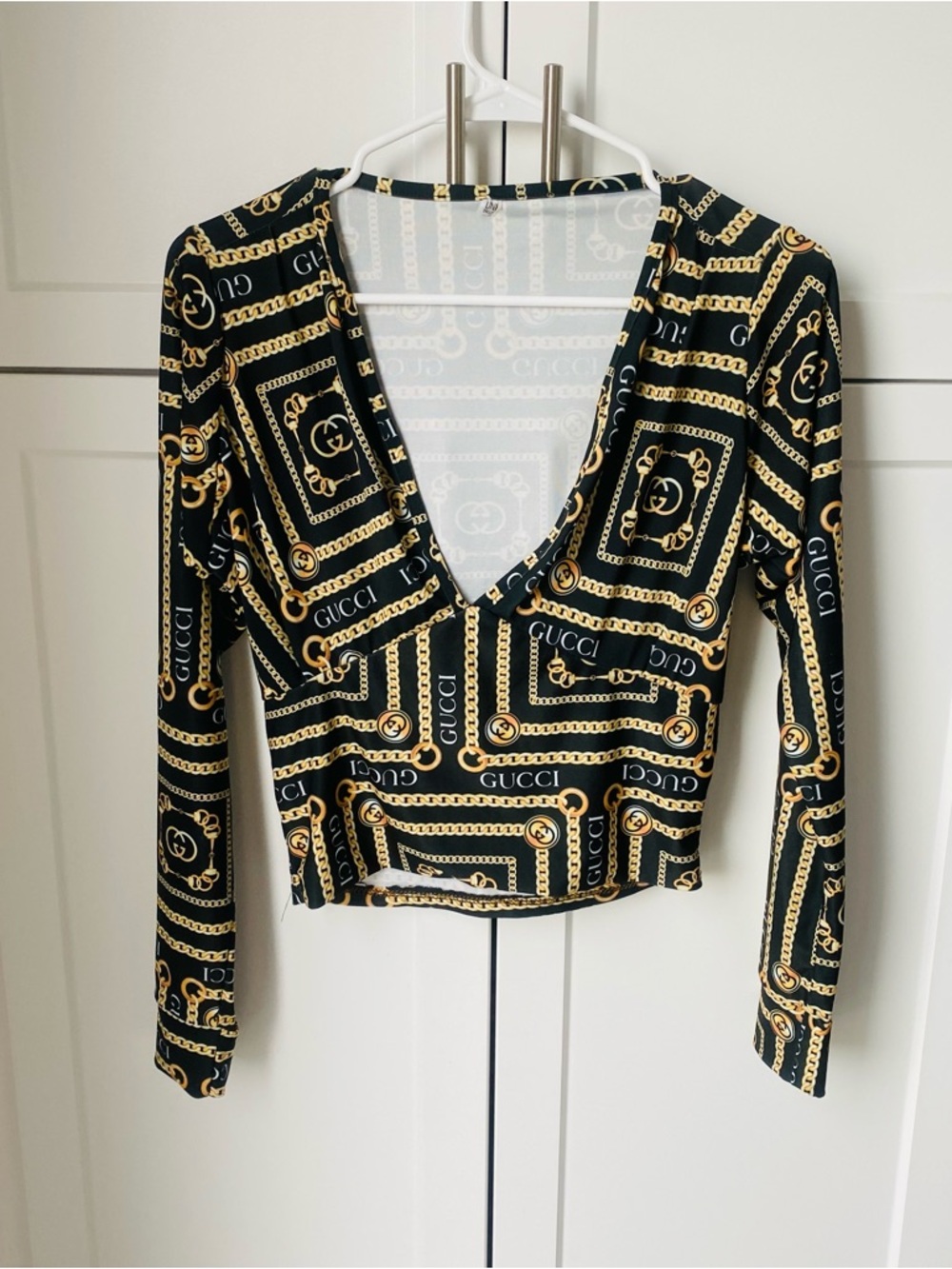 GUCCI womens tall long sleeve plunge neck logo